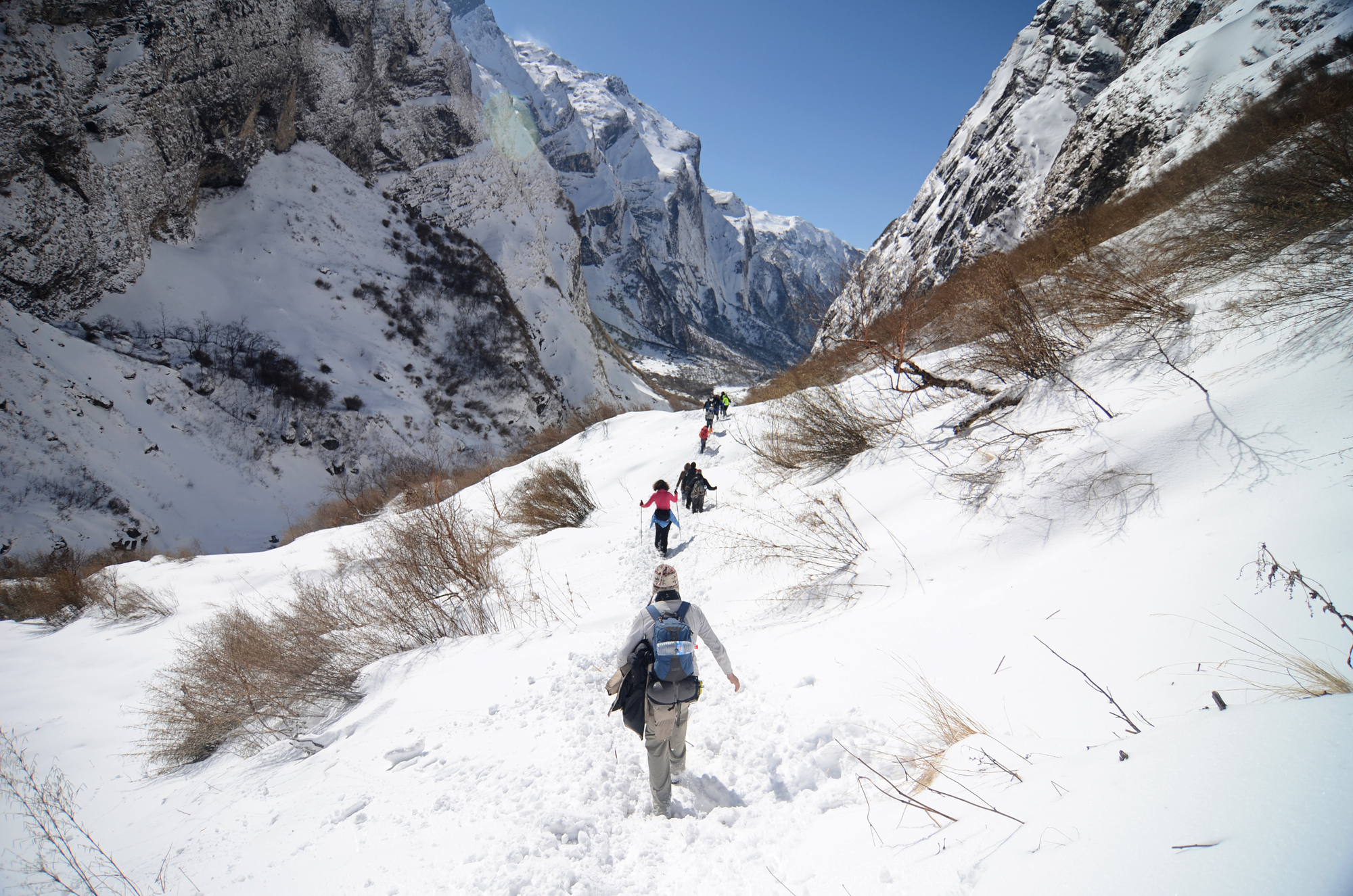 Trekking through the snowy gorge to ABC, Nepal - By Mountain People